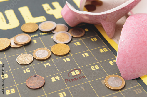 Broken piggy bank with coin...