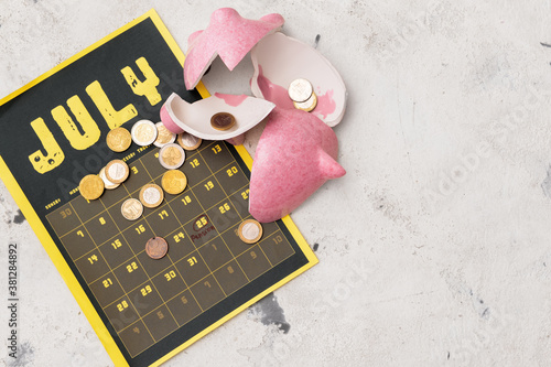 Broken piggy bank with coin...