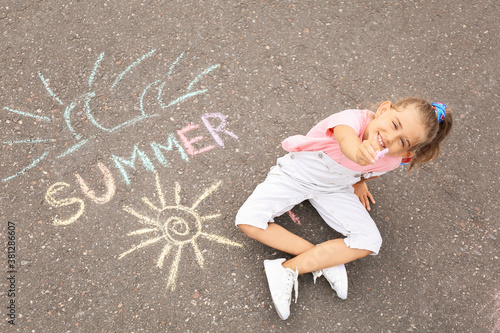 Little girl with written wo...