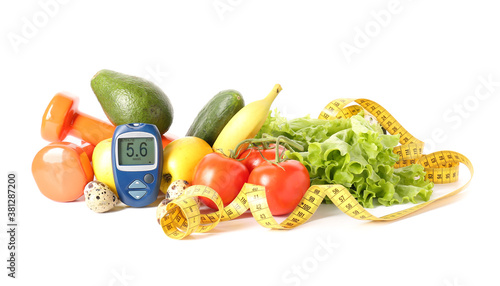 Fototapeta Naklejka Na Ścianę i Meble -  Vegetables, fruits, measuring tape and glucometer on white background. Diabetes concept