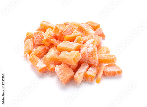 Frozen carrot pieces on white background