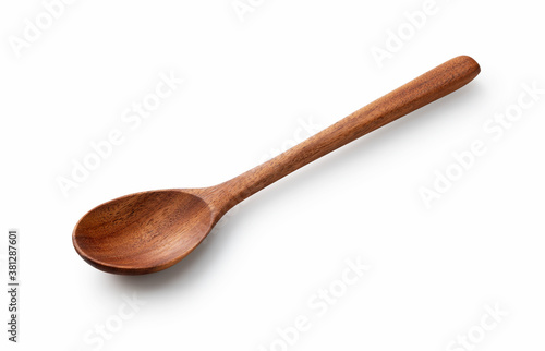 Wooden spoon placed on a white background photo