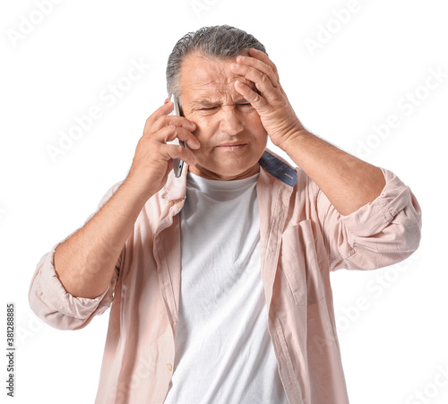 Stressed mature man talking...