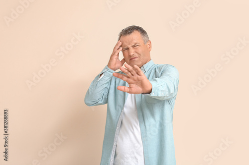 Stressed mature man on colo...