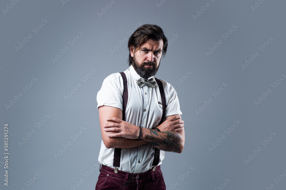 true confidence. barbershop. mature barber in retro style. bearded man in  suspenders. brutal guy wear bow tie. elegant male fashion look. handsome  hipster in formal wear. party goer Photos | Adobe Stock