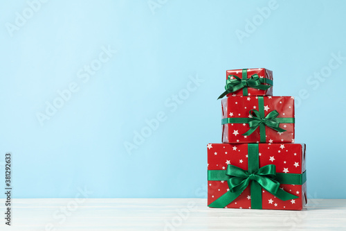 Christmas boxes on blue background, space for text