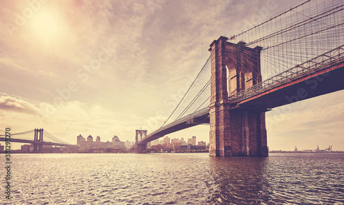 Fototapeta Naklejka Na Ścianę i Meble -  Vintage toned picture of Brooklyn Bridge against the sun, New York City, USA.