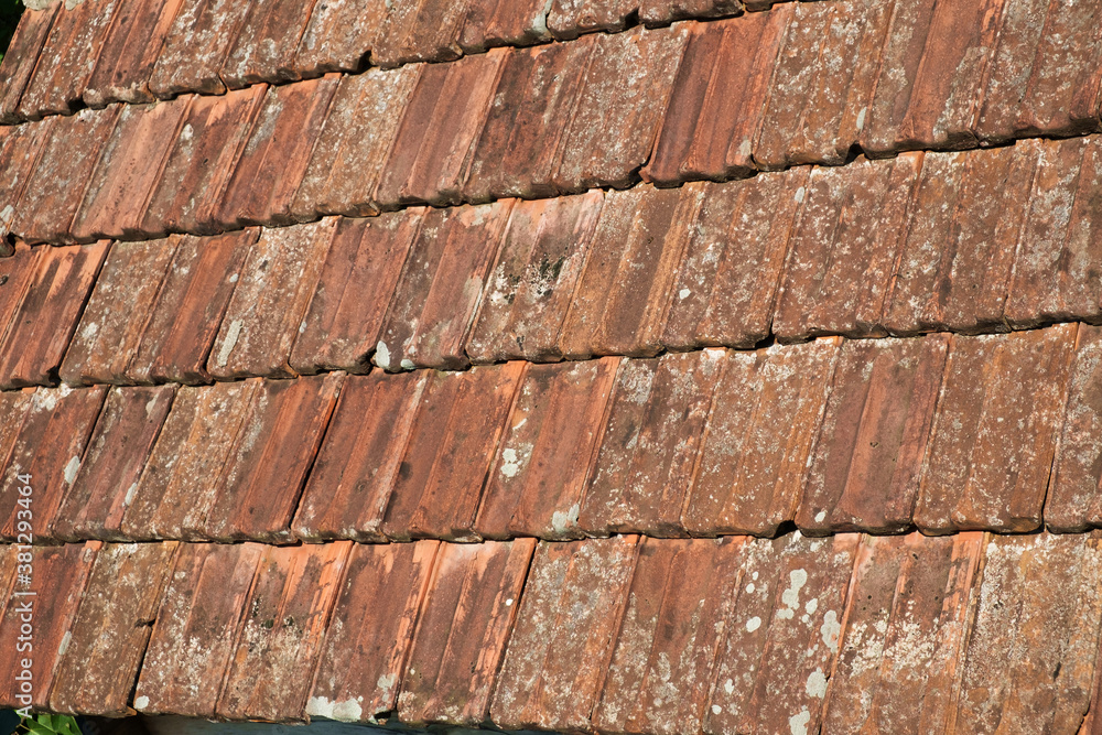 Background of an old clay brown roof tiles Background of an old clay brown roof tiles