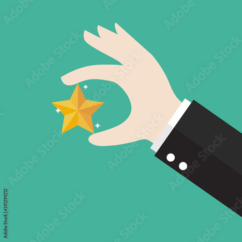 Businessman hand picking up a star