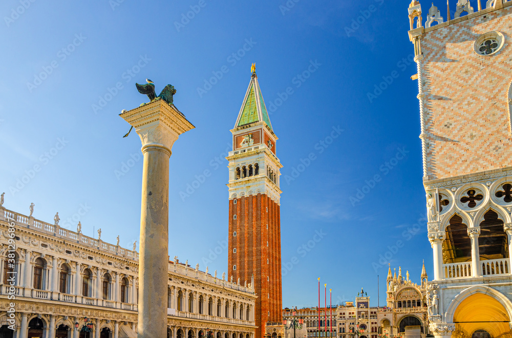 Venice cityscape with Campanile bell tower, Biblioteca Marciana Library or Library of Saint Mark and Lion of Venice column in Piazzetta San Marco St Mark's Square, Veneto Region, Northern Italy