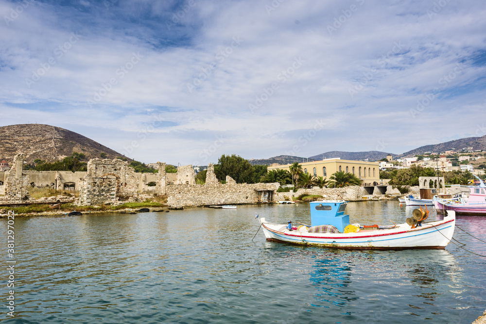 fishing boat docked near industrial port of Ermoupolis in Syros island, Cyclades, Greece