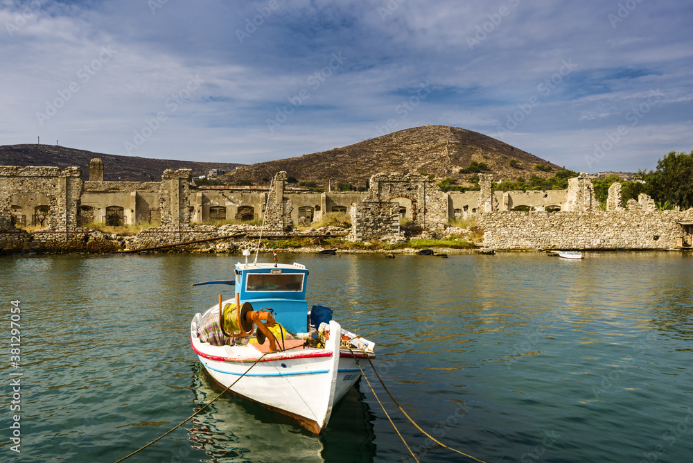 fishing boat docked near industrial port of Ermoupolis in Syros island, Cyclades, Greece