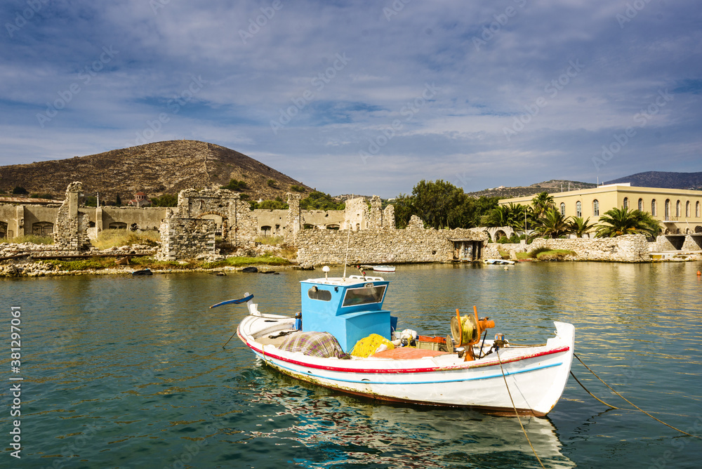 fishing boat docked near industrial port of Ermoupolis in Syros island, Cyclades, Greece