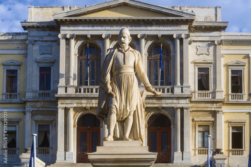 Ermoupolis City Hall with the statue of Andreas Miaoulis in Syros island, Cyclades, Greece