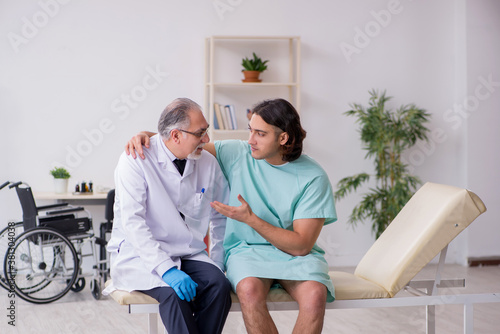 Young male patient visiting experienced doctor