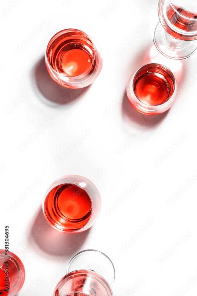 Red wine glasses on wine tasting. Degustation different varieties of red wine concept. White background, top view, hard light Red wine glasses on wine tasting. Degustation different varieties of red wine concept. White background, top view, hard light