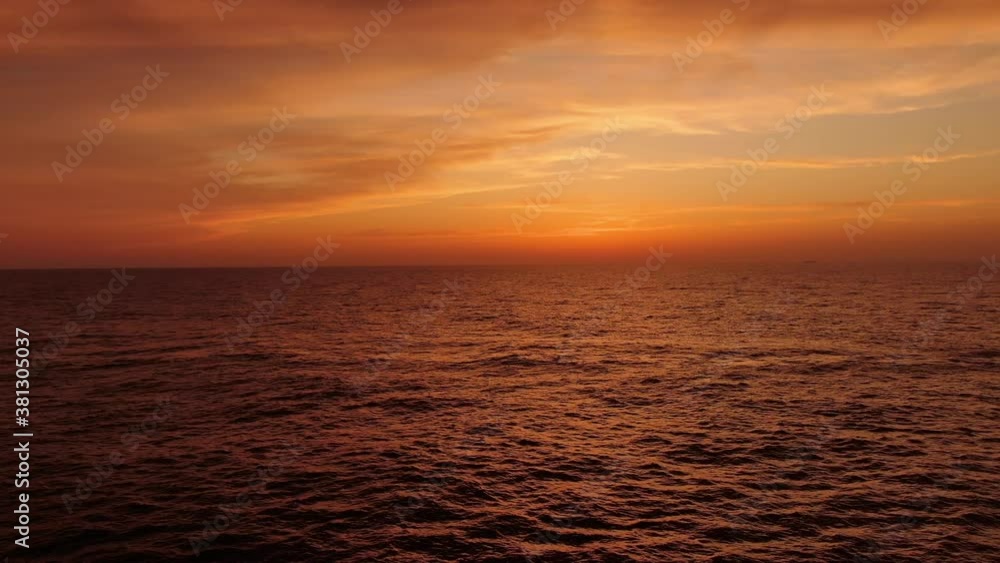 Sunset. Reflection of the sun in the water. Sailing ship in the open ocean. Japan sea. Travel. Freedom. Sunset. Reflection of the sun in the water. Sailing ship in the open ocean. Japan sea. Travel. Freedom.