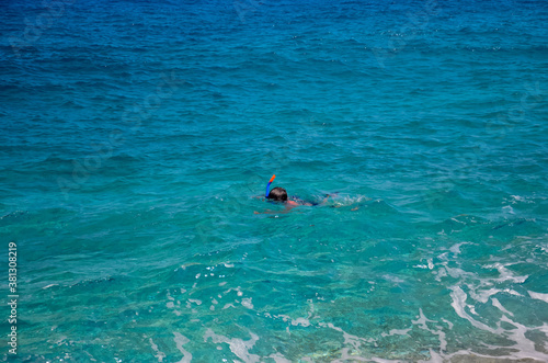 Caucasian adult male snorkeling in the Ionian Sea, near Platia Ammos Beach, in Kefalonia, Greece