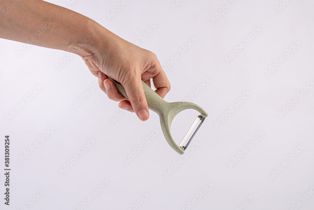 hand holding paring knife isolated on a white background