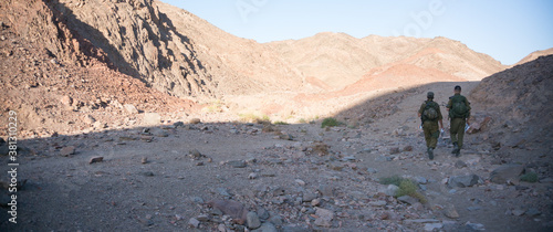 Soldiers patrol in desert