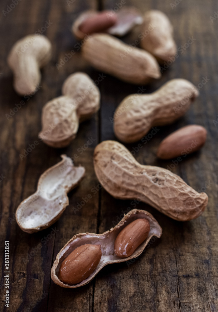 Peanuts on a wooden background.