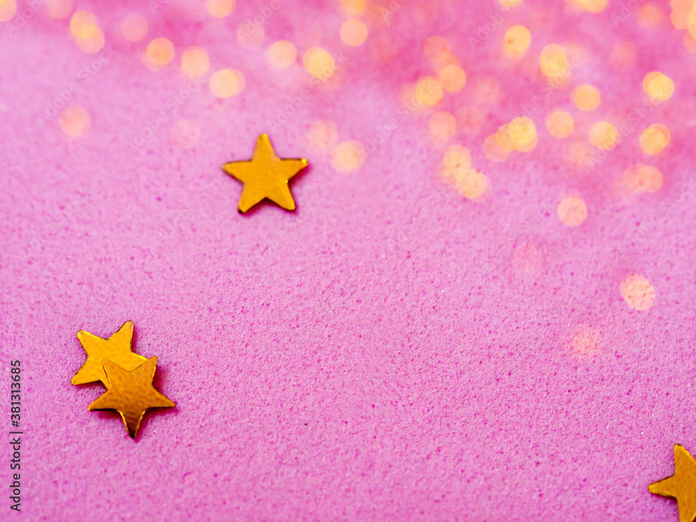 Gold star glitter confetti splashed on pink paper background. Festive ...