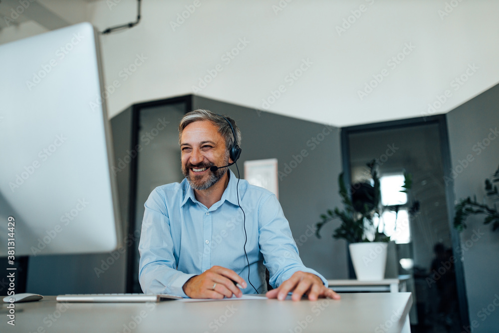 Mature man, dressed casually working. Mature man, dressed casually working.