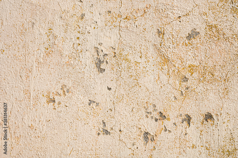 Grunge background of cracked cloud peeled putty wall in beige tones Grunge background of cracked cloud peeled putty wall in beige tones