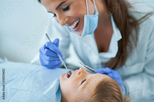 Little boy and female dentist in the dentists office