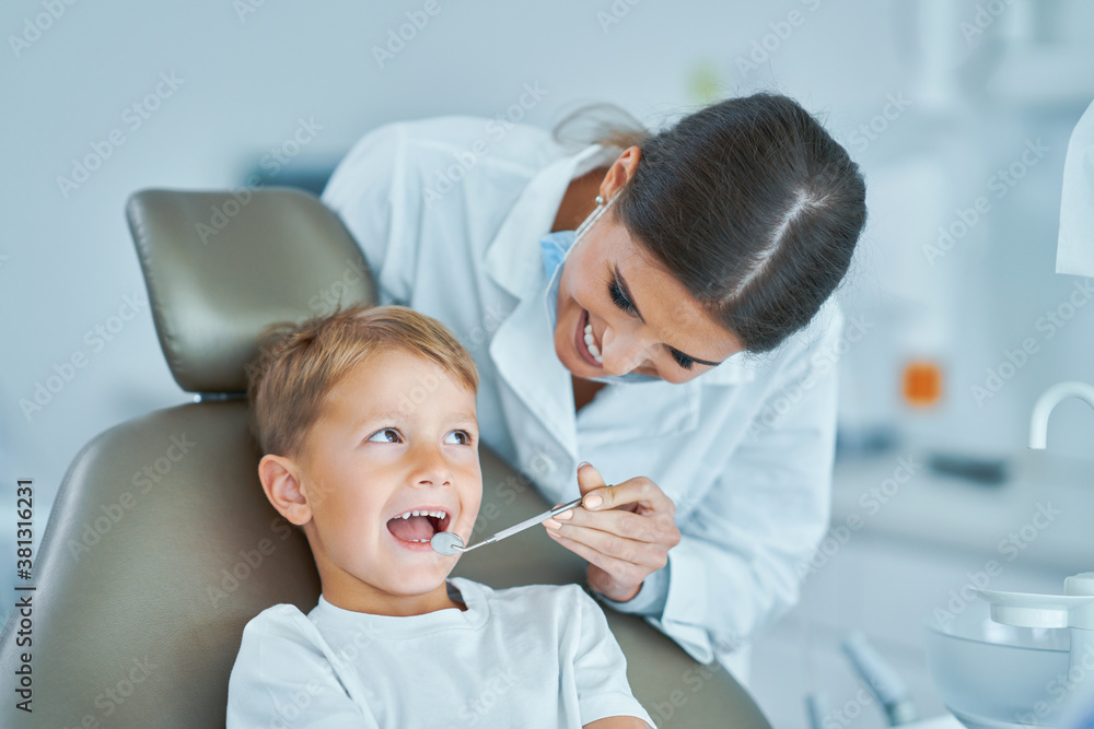 Little boy and female dentist in the dentists office Little boy and female dentist in the dentists office