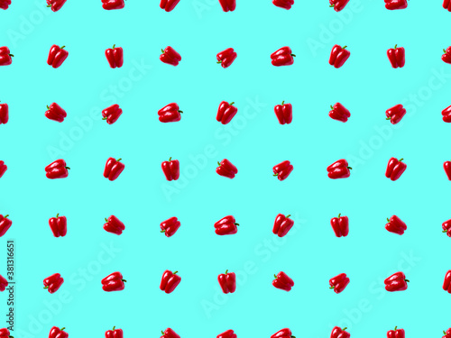 sweet bell pepper pattern. vegetables on a blue background.