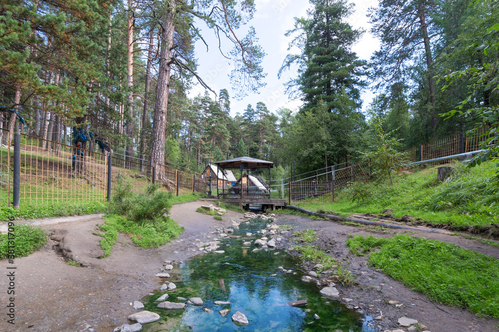 The stream flows from a hot mineral spring. The popular balneological resort of Buryatia, Goryachinsk. Summer