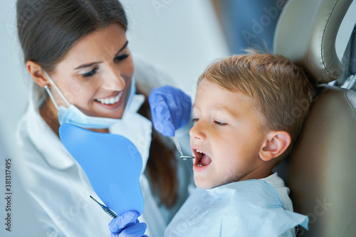 Little boy and female dentist in the dentists office