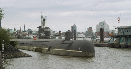 Russian submarine from the Second World War is in the port of Hamburg. Germany. The submarine is used as a museum and is visited by tourists from different countries. photo