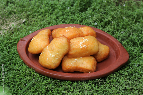 Homemade Odading Indonesian traditional food. Most viral Indonesia food in 2020. Pillow cake or indonesian language called kue bantal with sesame seed.  photo