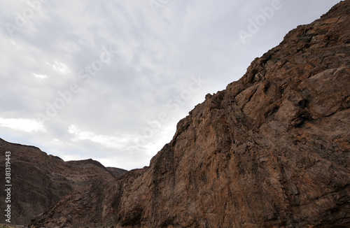 Cliffs in the Gamkab valley of southern Namibia against a cloudy sky
