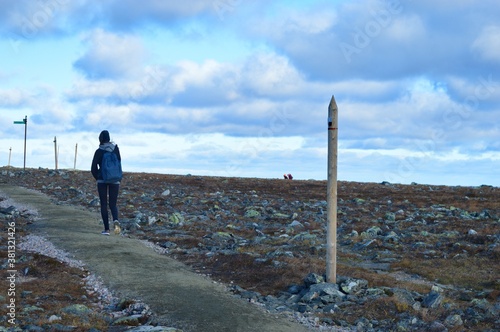 Pallas - Yllastunturi national park, mountains, trails and fall in Finnish Lapland. Woman on the hike.