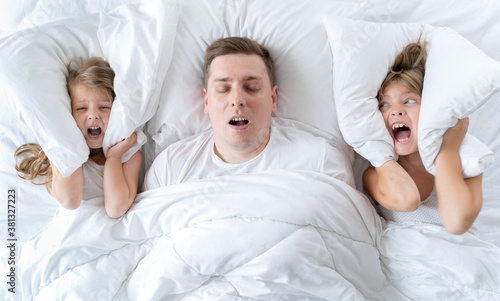 Fotografie Kids, dad sleep together in bed