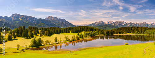 panoramic landscape in Bavaria with mountain range and lake © Wolfilser