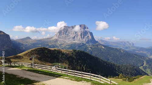 Val Gardena, Italy - 09/15/2020: Scenic alpine place with magical Dolomites mountains in background, amazing clouds and blue sky in Trentino Alto Adige region, Italy, Europe © yohananegusse