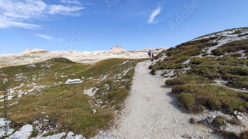 Val Gardena, Italy - 09/15/2020: Scenic alpine place with magical Dolomites mountains in background, amazing clouds and blue sky in Trentino Alto Adige region, Italy, Europe