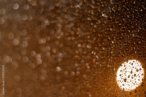 Raindrops in a window at night