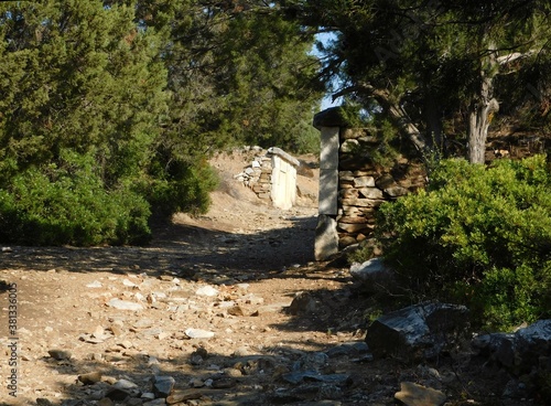 A road with burial enclosures, leading to the ancient city of Rhamnous, in Attica, Greece photo