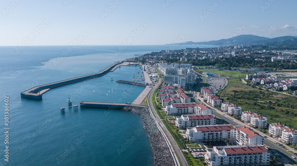 Aerial view of blue coast of Black Sea in summer Olympic Park in Sochi. Modern house. Sea port. Imeretinsky resort.