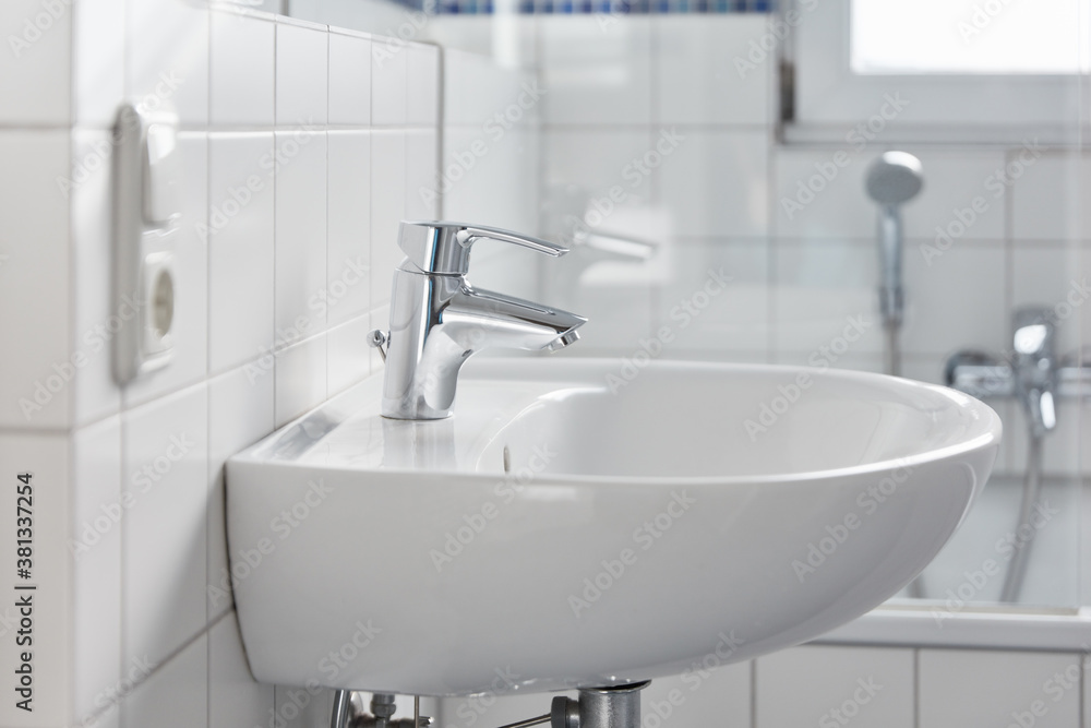 Fototapeta premium Sink with faucet in the bathroom at home