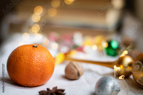 Tangerine close-up on a background of colorful lights