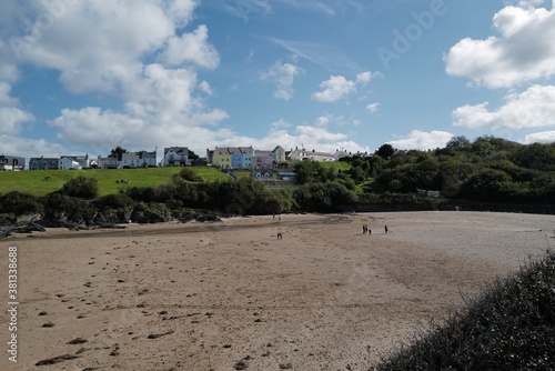 Aberporth beach on a sunny autumn day - colourful seaside houses