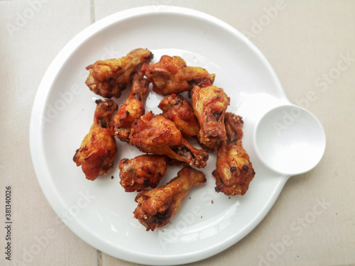 Fried chicken is a crispy and tasty on white dish.