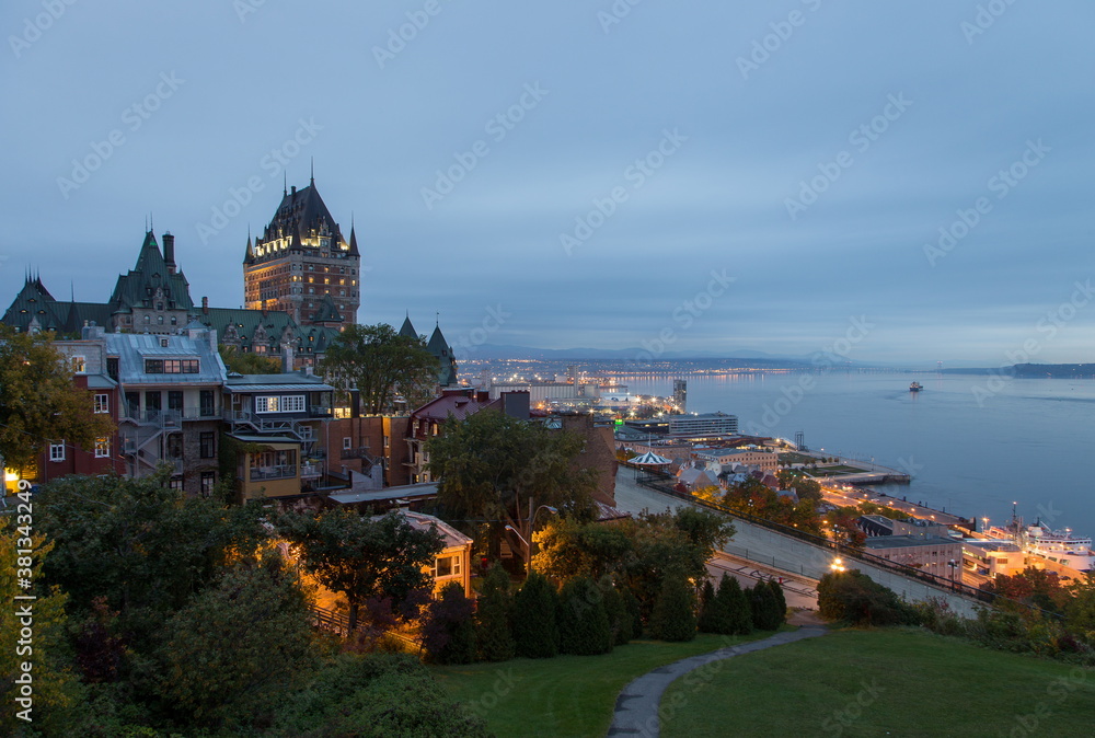 Blue hour view of the Old Quebec, the port and the St. Lawrence River seen from the Cape Diamond, Quebec City, Quebec, Canada Blue hour view of the Old Quebec, the port and the St. Lawrence River seen from the Cape Diamond, Quebec City, Quebec, Canada