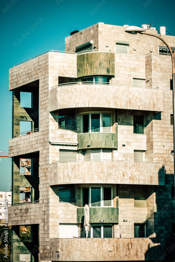 View of the facade of a modern building in the streets of Tel Aviv in Israel View of the facade of a modern building in the streets of Tel Aviv in Israel